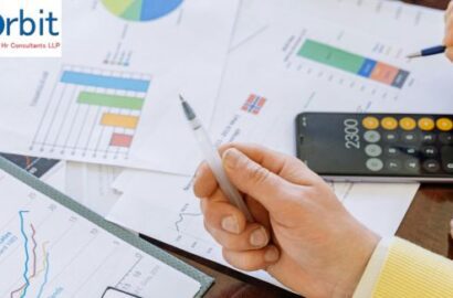 HR professionals analyzing employee data on a digital dashboard to improve recruitment, performance, and retention through people analytics.